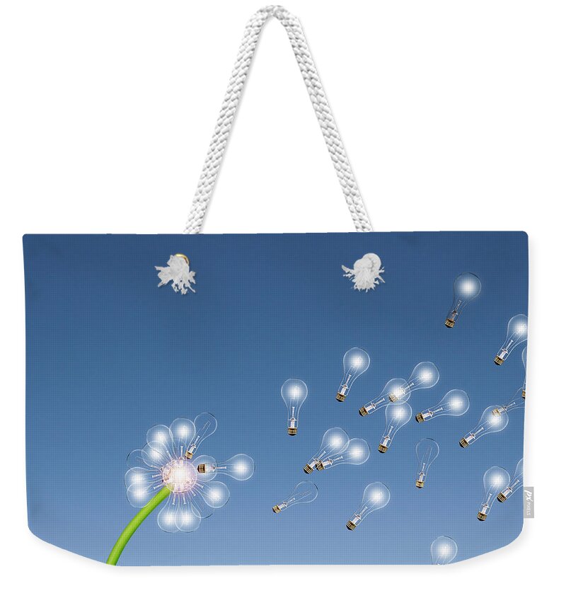 Environmental Conservation Weekender Tote Bag featuring the photograph Light Bulbs Flying Off Dandelion by John M Lund Photography Inc