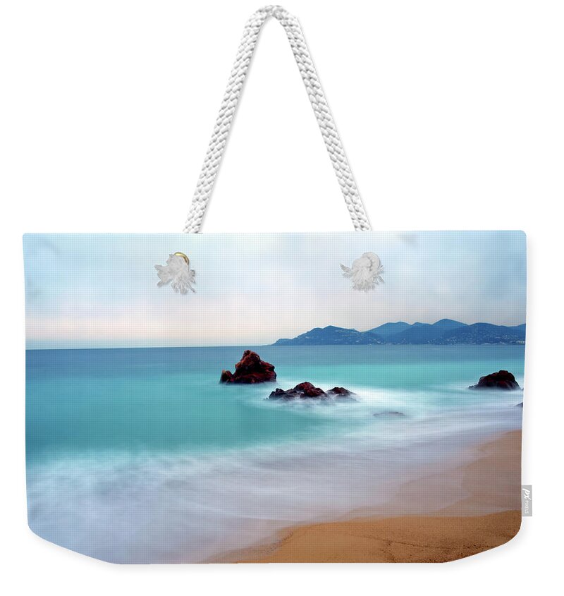 Scenics Weekender Tote Bag featuring the photograph Long Exposure Of Blue Sea by Federica Fortunat