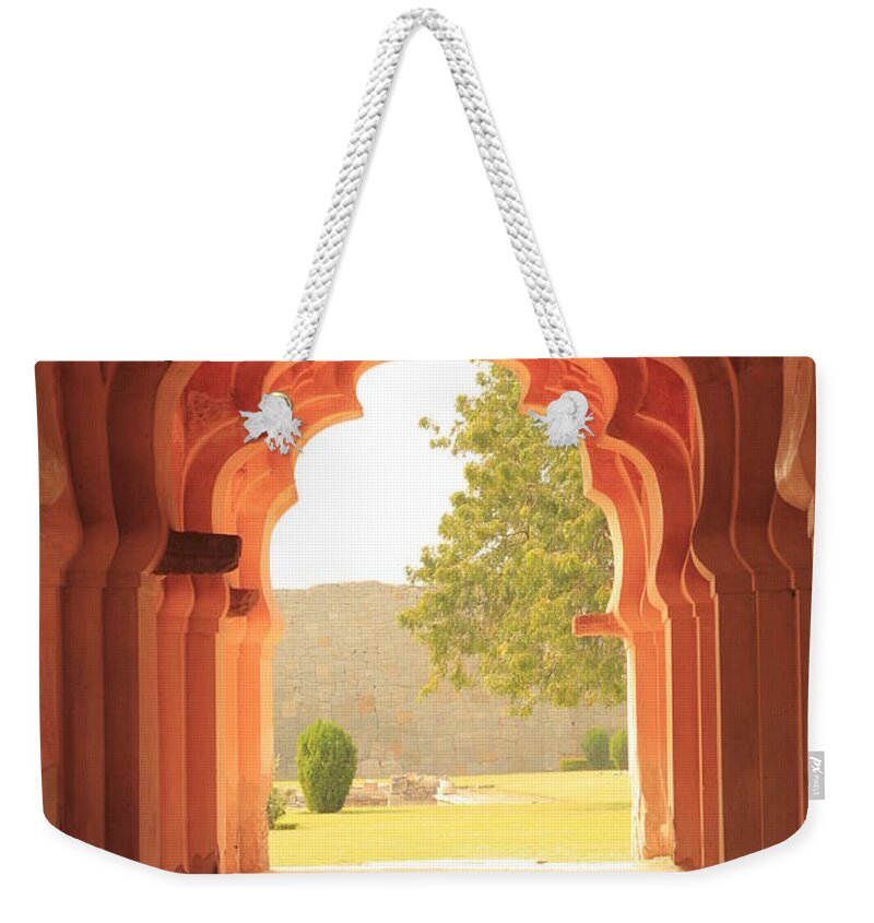 Tranquility Weekender Tote Bag featuring the photograph Lotus Mahal by Jon Anderson