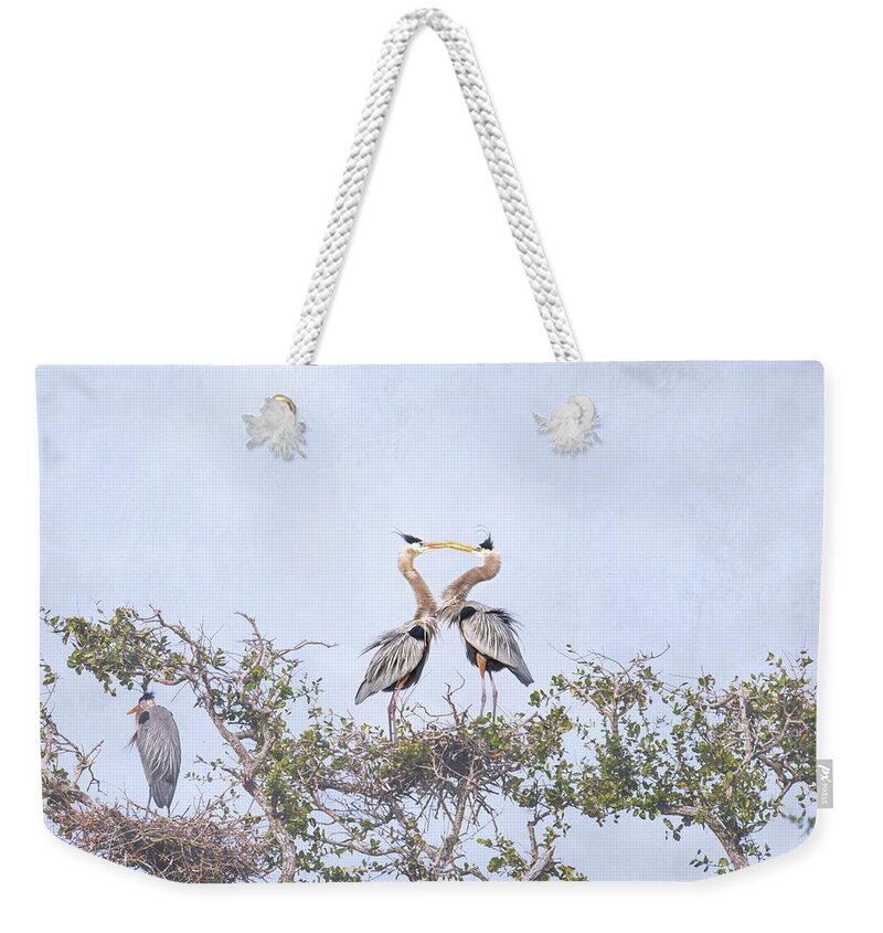 Debra Martz Weekender Tote Bag featuring the photograph Love Is In The Air - Great Blue Herons by Debra Martz