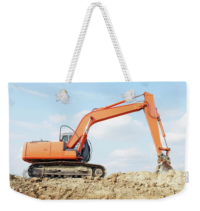 Heap Weekender Tote Bag featuring the photograph Low Angle View Of Construction Excavator by Steven Puetzer