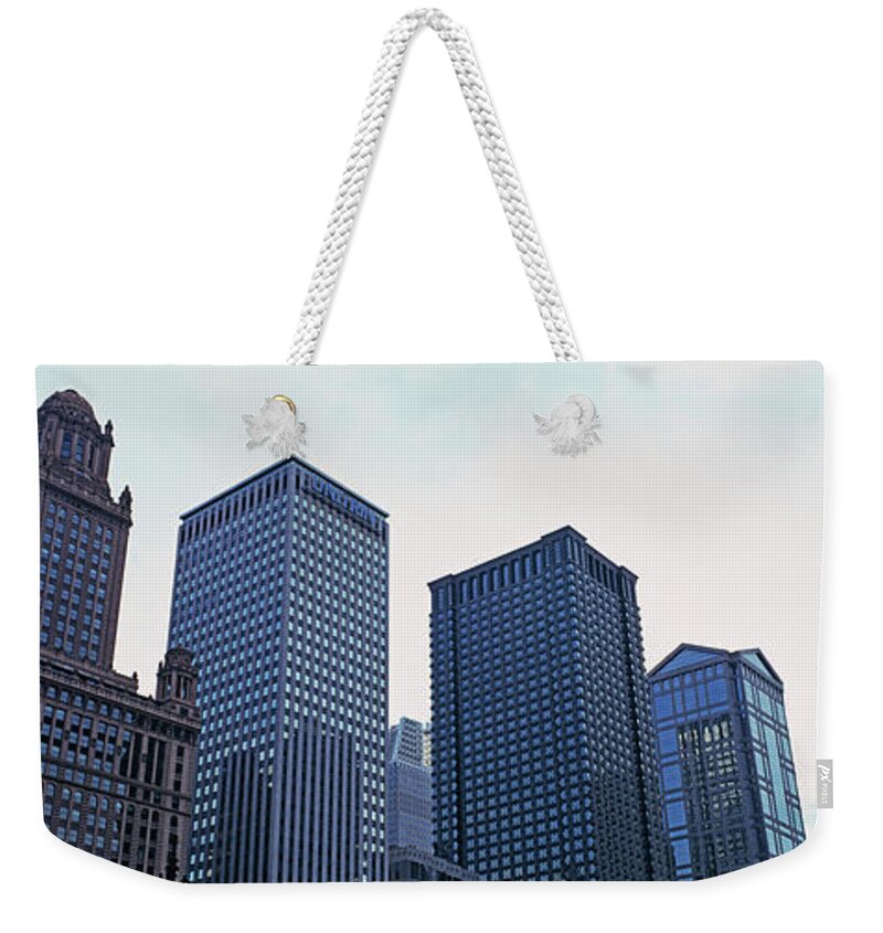 Downtown District Weekender Tote Bag featuring the photograph Low Angle View Of Skyscrapers by Murat Taner