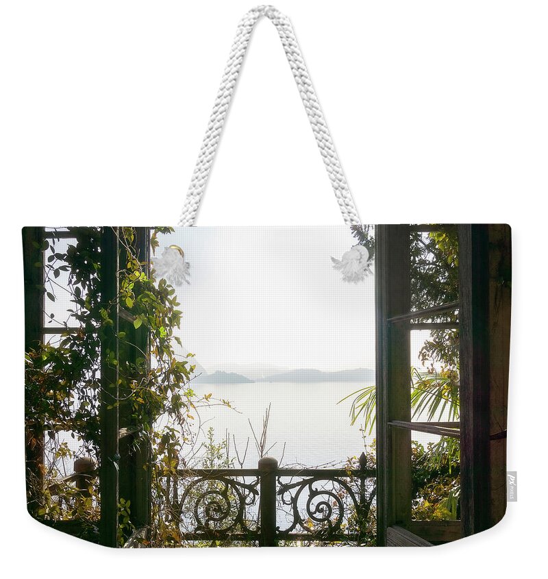 Urban Weekender Tote Bag featuring the photograph Magical View through Window by Roman Robroek