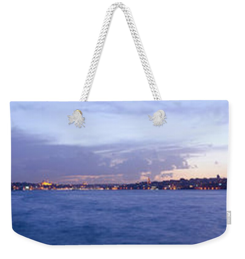 Water's Edge Weekender Tote Bag featuring the photograph Maidens Tower And Istanbul Panorama by Funky-data