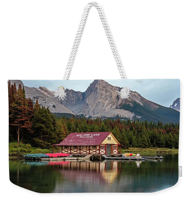 Jasper Weekender Tote Bag featuring the photograph Maligne Lake Boat House and Mountain Jasper National Park Albert Canada Canadian Rockies Mountain by Toby McGuire