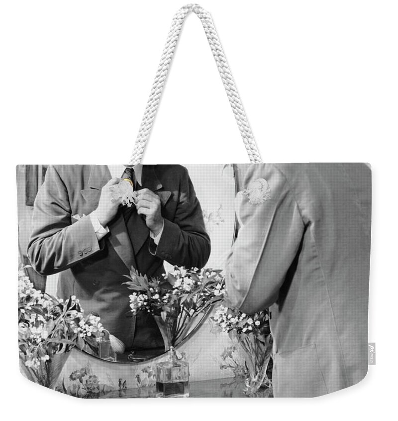 Three Quarter Length Weekender Tote Bag featuring the photograph Man Checking Himself Out In Mirror by George Marks