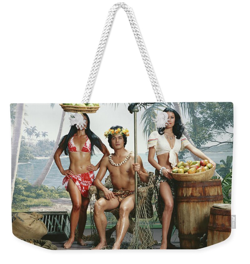 People Weekender Tote Bag featuring the photograph Man Holding Stick And Woman With Basket by Tom Kelley Archive