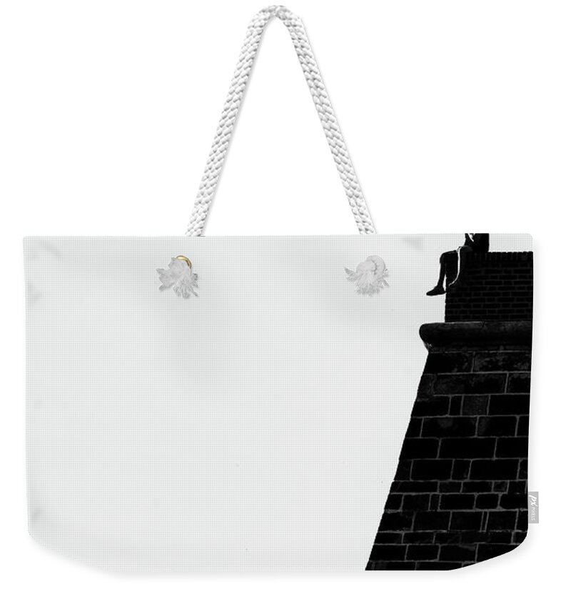 Man Weekender Tote Bag featuring the photograph Man on the Wall by Martin Vorel Minimalist Photography