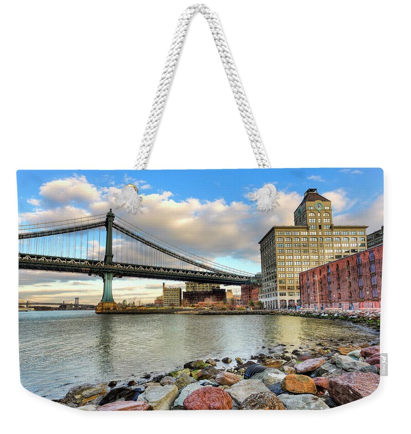 Water's Edge Weekender Tote Bag featuring the photograph Manhattan Bridge During Sunset by Pawel.gaul