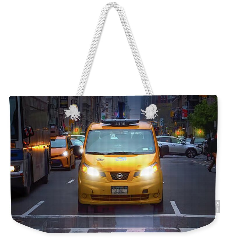 New York Weekender Tote Bag featuring the photograph Manhattan Taxi on a Rainy Day by Mark Andrew Thomas