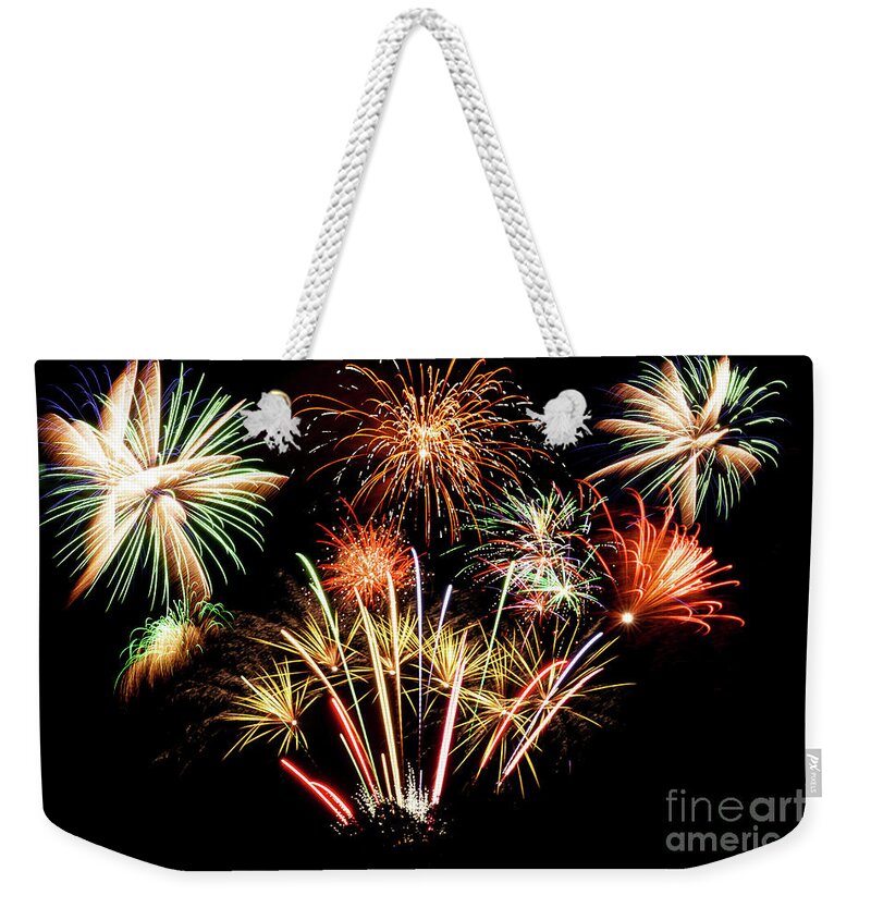 Fireworks Weekender Tote Bag featuring the photograph Many firework explosions in the sky by Simon Bratt