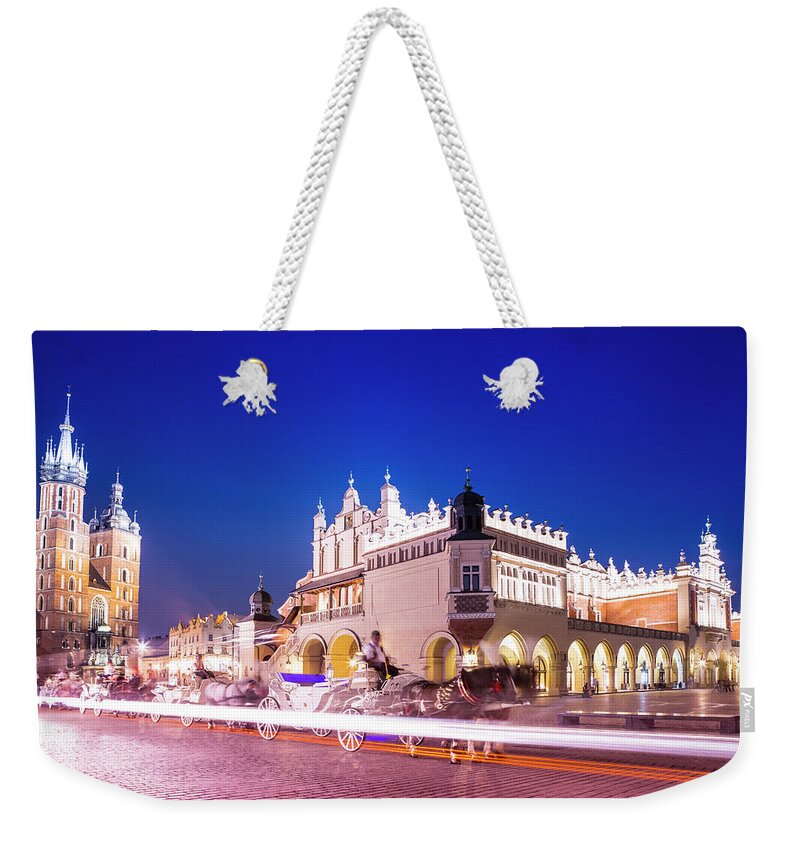 Rynek Glowny Square Weekender Tote Bag featuring the photograph Market Square, Krakow, Poland by Espiegle