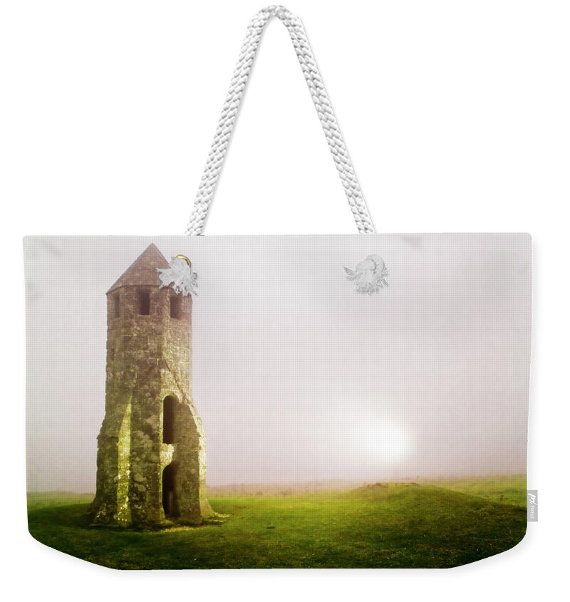 Tranquility Weekender Tote Bag featuring the photograph Medieval Lighthouse by David Yates