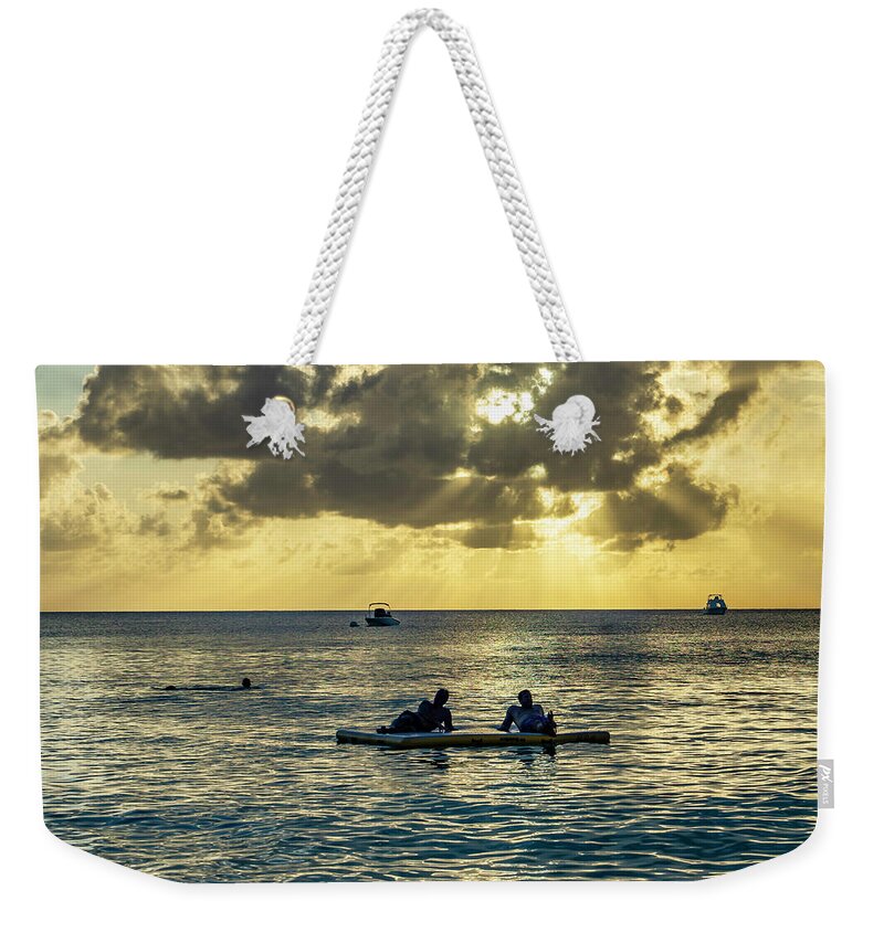 Estock Weekender Tote Bag featuring the digital art Men On Float At Sunset, Cayman Is by Angela Pagano