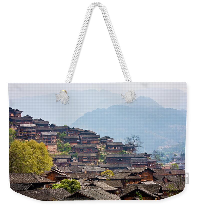 Miao Minority Weekender Tote Bag featuring the photograph Miao Nationality Village by Zhouyousifang