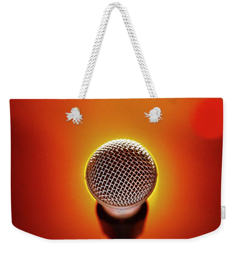 Microphone Stand Weekender Tote Bag featuring the photograph Microphone At A Concert by Henrik Sorensen