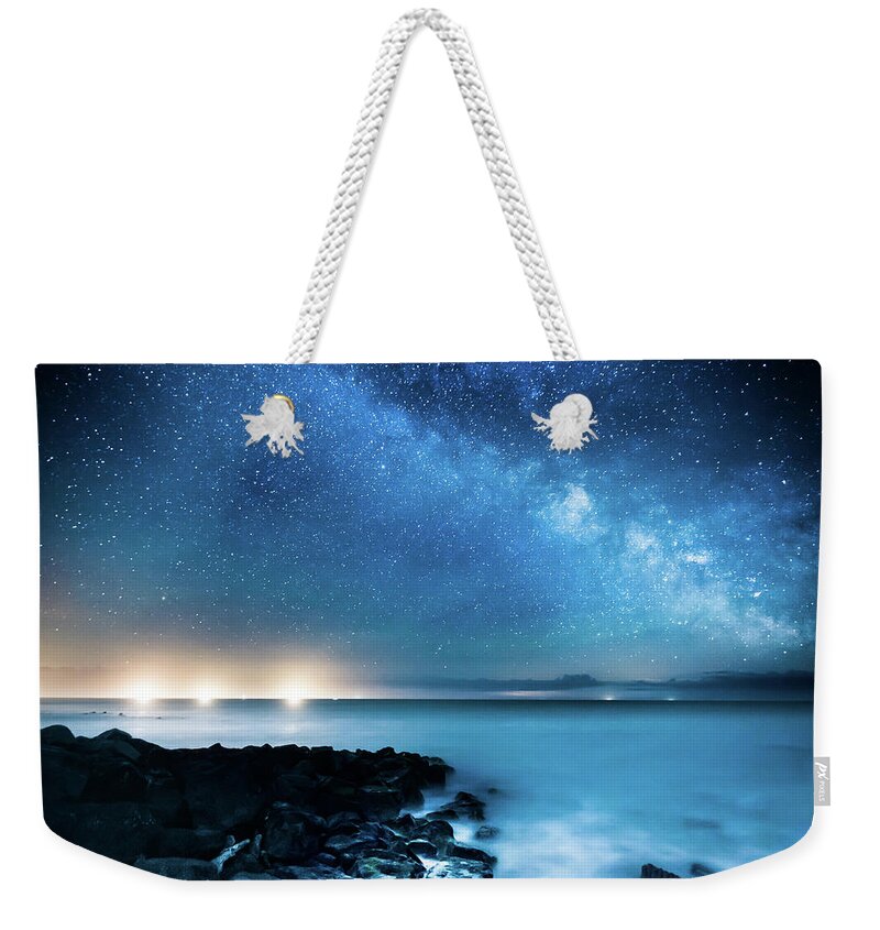 Scenics Weekender Tote Bag featuring the photograph Milky Way Galaxy Over Fishing Boats by Property Of Chad Powell