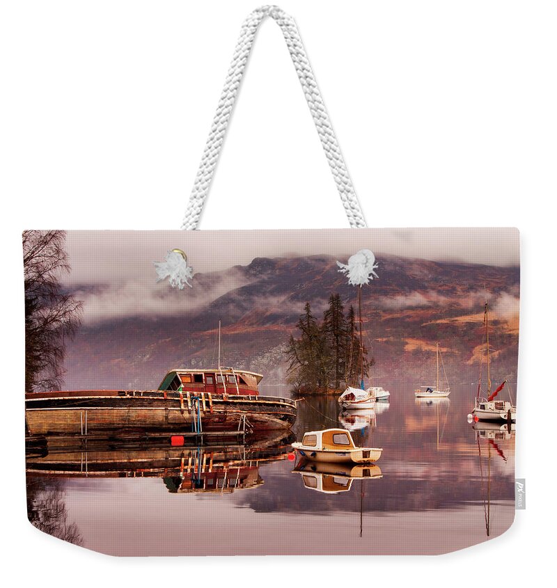 Loch Ness Weekender Tote Bag featuring the photograph Misty morning reflections of Loch Ness by Ian Middleton