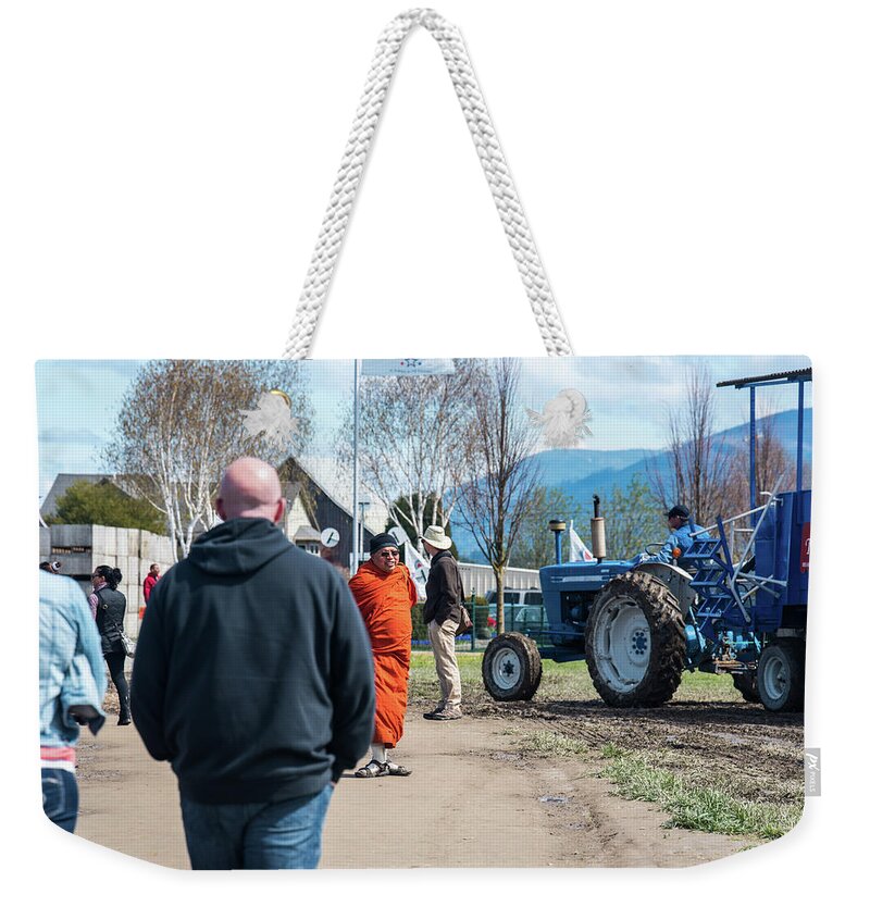 Monk And Tractor Weekender Tote Bag featuring the photograph Monk and Tractor by Tom Cochran
