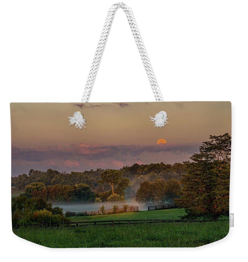 Moon Weekender Tote Bag featuring the photograph Moonset at Sunrise by Ulrich Burkhalter