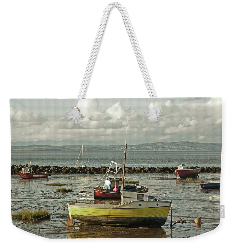 Morecambe Weekender Tote Bag featuring the photograph MORECAMBE. Boats On The Shore. by Lachlan Main