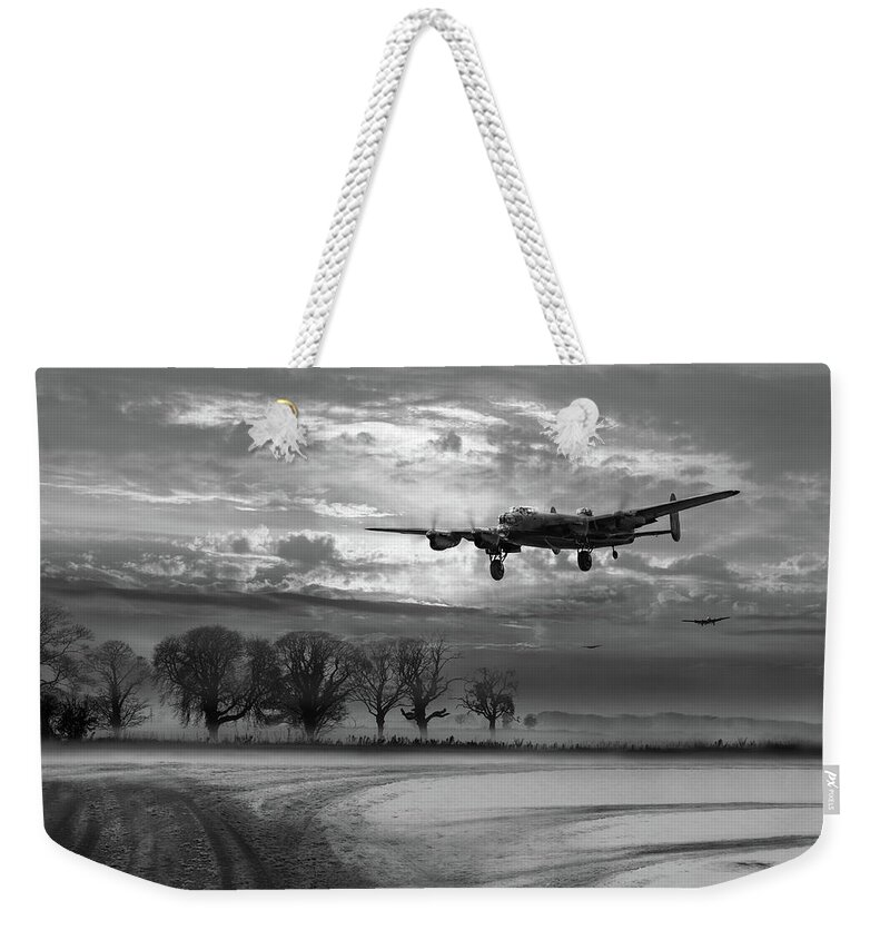 Avro 638 Lancaster Weekender Tote Bag featuring the photograph Morning return black and white version by Gary Eason