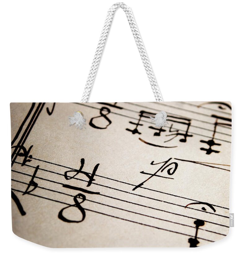 Notes Weekender Tote Bag featuring the photograph 	Music Sheet by Jelena Jovanovic
