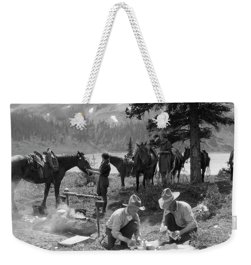 Horse Weekender Tote Bag featuring the photograph N The West, Two Men, Cowboy Guides by H. Armstrong Roberts
