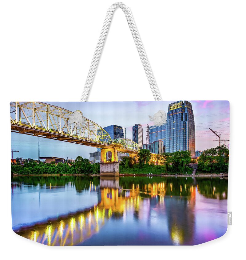America Weekender Tote Bag featuring the photograph Nashville Shelby Street Bridge Over Cumberland River at Dusk by Gregory Ballos