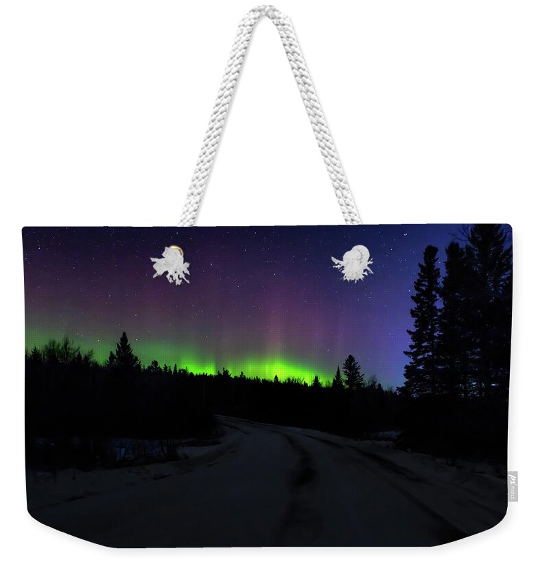 Northern Lights Weekender Tote Bag featuring the photograph Night Dancer by Susan Rissi Tregoning