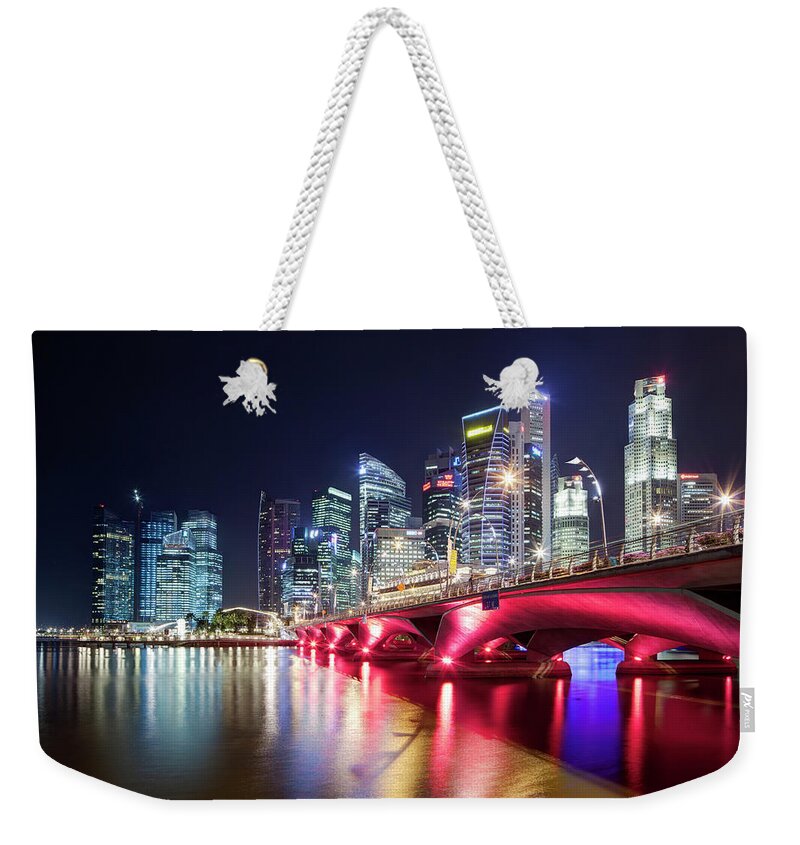 Built Structure Weekender Tote Bag featuring the photograph Night View Over Marina Bay To Singapore by David Clapp