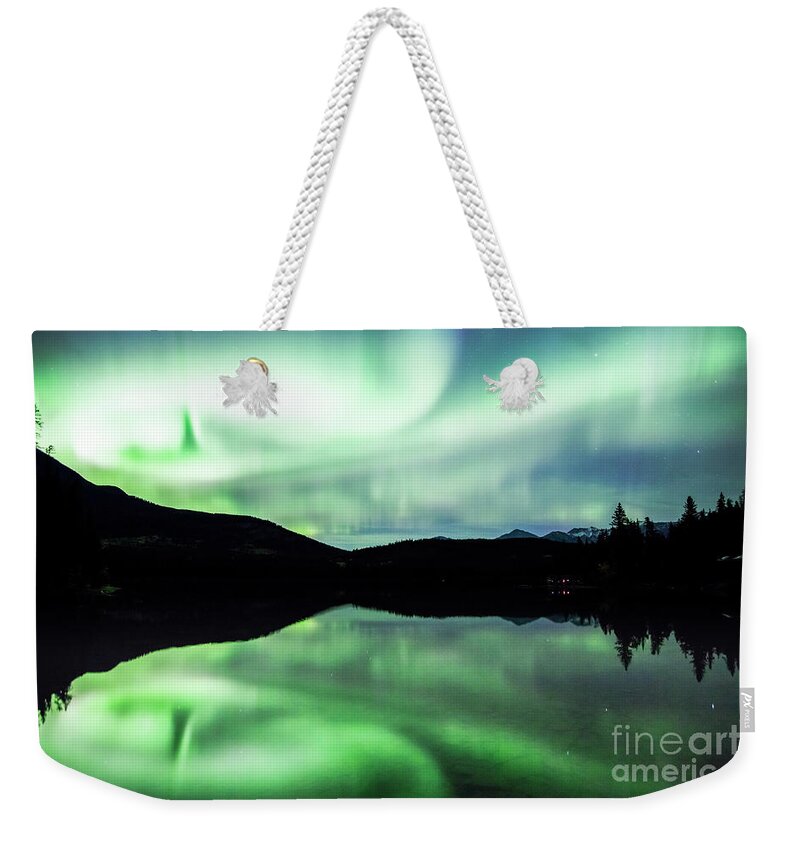 Northern Lights Weekender Tote Bag featuring the photograph Northern lights, Canada by Matteo Colombo