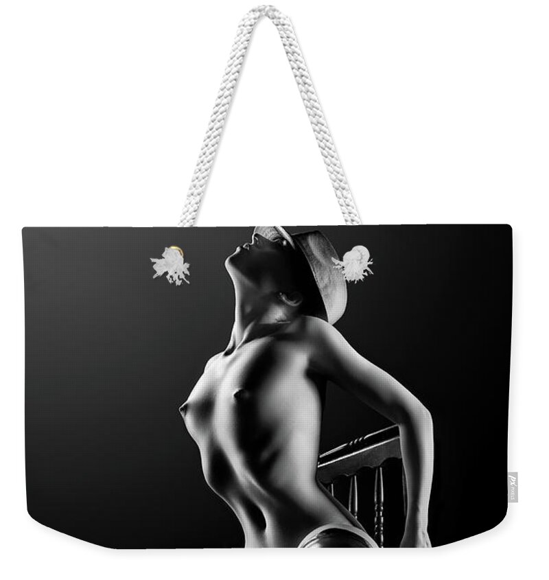 Woman Weekender Tote Bag featuring the photograph Nude woman on chair 2 by Johan Swanepoel