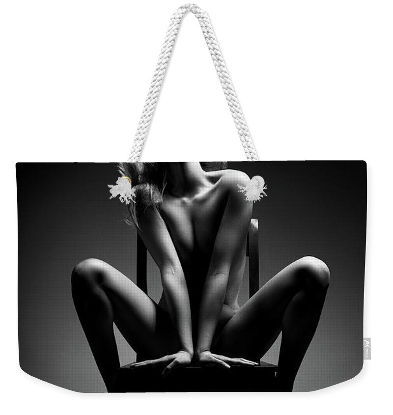 Woman Weekender Tote Bag featuring the photograph Nude woman sitting on chair by Johan Swanepoel