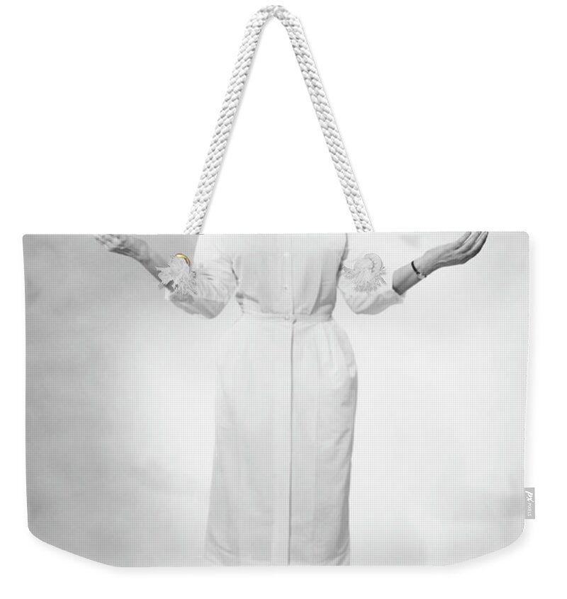 Human Arm Weekender Tote Bag featuring the photograph Nurse Gesturing In Studio, B&w by George Marks