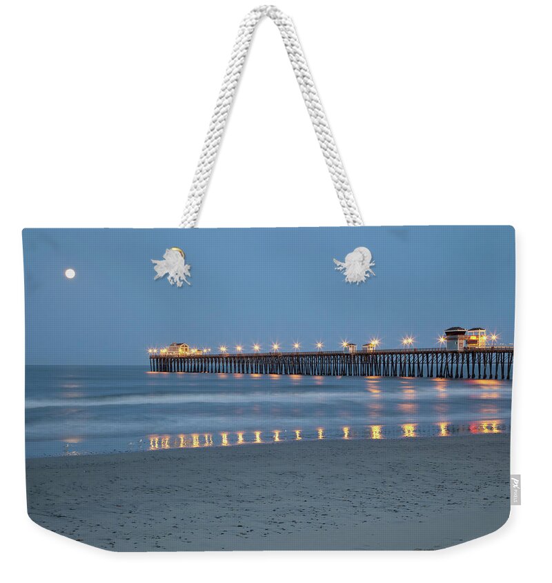 Moonset Over Pacific Weekender Tote Bag featuring the photograph Oceanside California Moonset at Sunrise Summer Solstice at Pier by Catherine Walters
