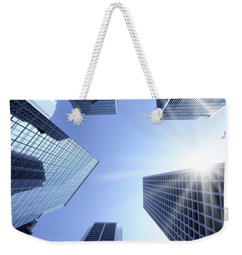 Corporate Business Weekender Tote Bag featuring the photograph Office Buildings In The Sun by Blackred
