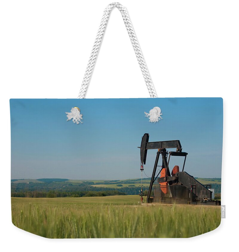 Non-urban Scene Weekender Tote Bag featuring the photograph Oil Pump Pumpjack With Wheat In by Millraw