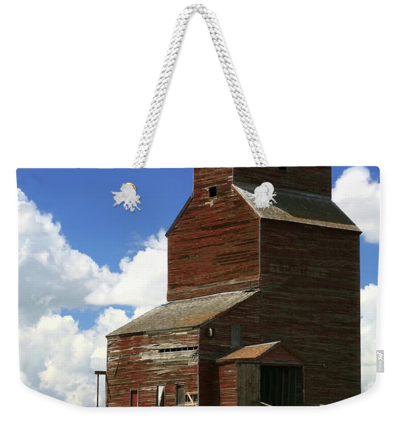 Scenics Weekender Tote Bag featuring the photograph Old Grain Elevator by Imaginegolf