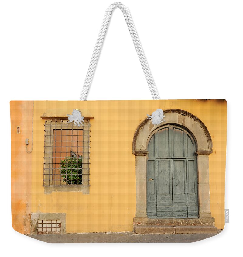 Orange Color Weekender Tote Bag featuring the photograph Old Italian Door by Amesy