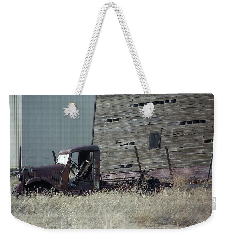 Old Truck Weekender Tote Bag featuring the photograph Old Truck and Tower by Julie Rauscher