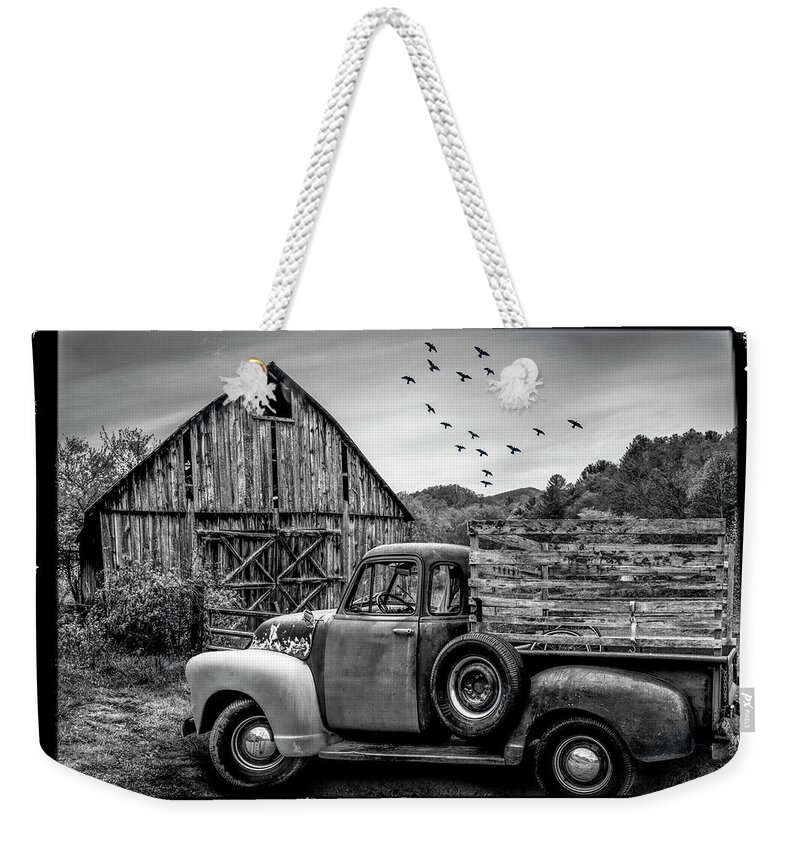 1947 Weekender Tote Bag featuring the photograph Old Truck at the Barn Bordered Black and White by Debra and Dave Vanderlaan