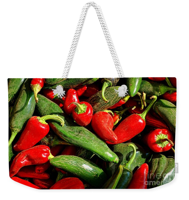 Red Weekender Tote Bag featuring the photograph Organic Red and Green Peppers by Olivier Le Queinec