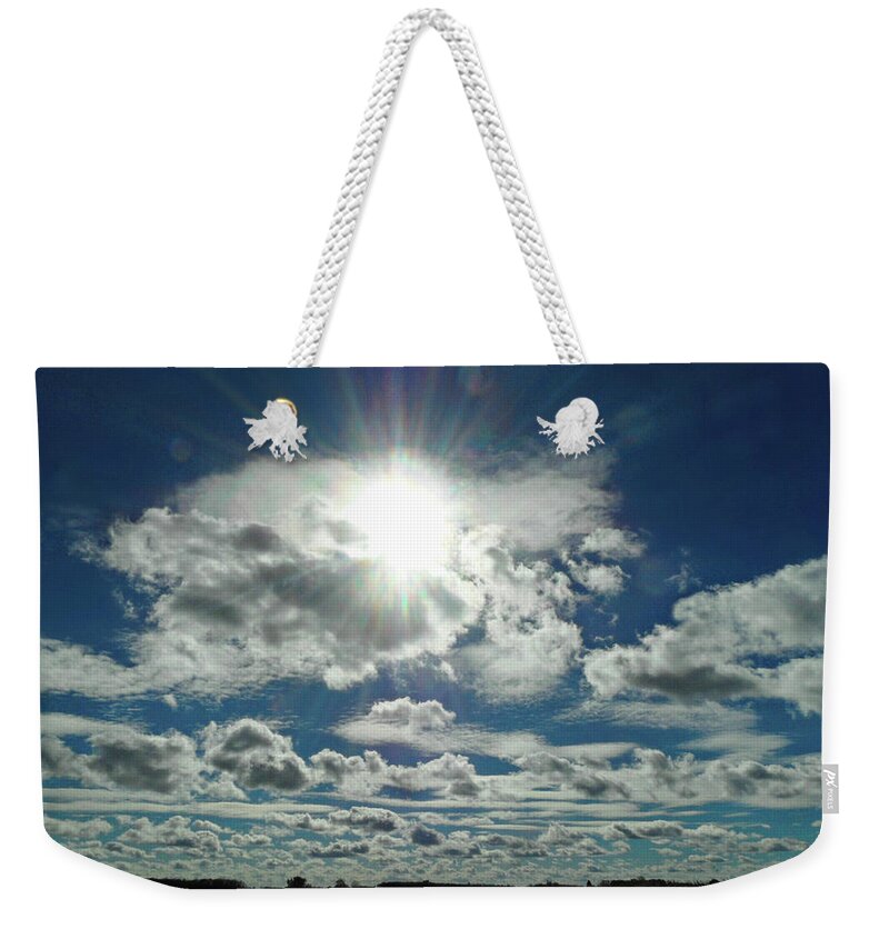Out Of The Blue Weekender Tote Bag featuring the photograph Out of the blue by Cyryn Fyrcyd