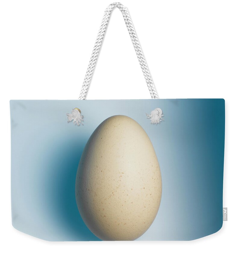 Pale Egg Against Blue Weekender Tote Bag