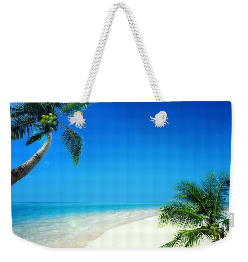 Clear Sky Weekender Tote Bag featuring the photograph Palm Trees And Sea by C.o.t/a.collectionrf