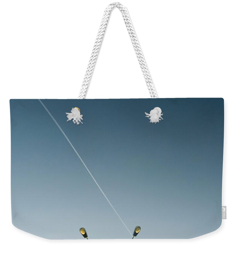 Parking Lot Weekender Tote Bag featuring the photograph Parking Lot Light At Airport, Vapour by Pete Starman
