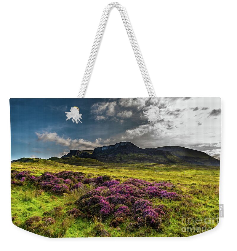 Abandoned Weekender Tote Bag featuring the photograph Pasture With Blooming Heather In Scenic Mountain Landscape At The Old Man Of Storr Formation On The by Andreas Berthold