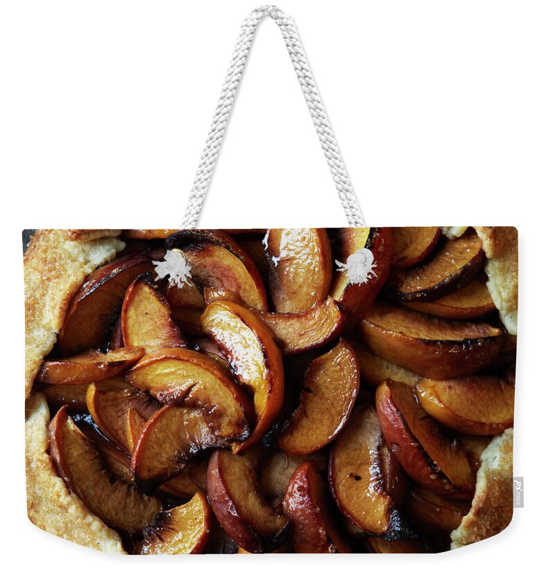 Lifestyles Weekender Tote Bag featuring the photograph Peach Galette by Iain Bagwell