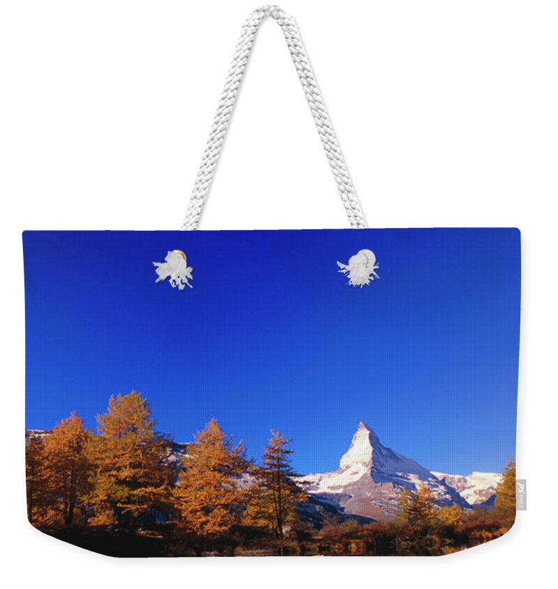 Snow Weekender Tote Bag featuring the photograph Peak Of The Matterhorn by Thomas Winz